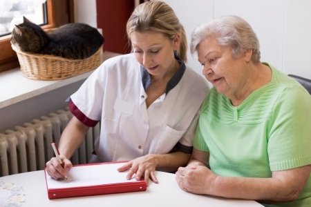 Caregiver helping patient with dementia